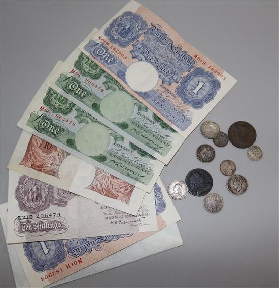 A group of assorted coins and banknotes